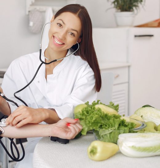 doctor-measures-pressure-patient-kitchen-min
